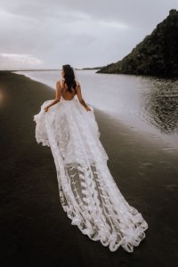 An Ivory embroidered Bespoke Wedding dress gown made with metres of tulle and a hand stitch feather lace bodice